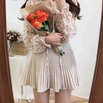 Jupe courte plissée beige