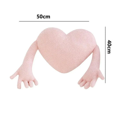 Coussin coeur avec bras rose