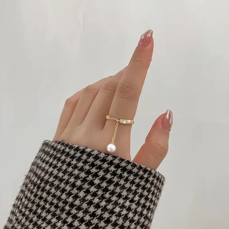 Bague pendentif réglable diamants perle