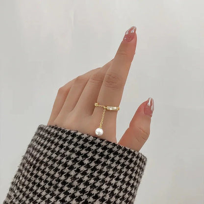 Bague pendentif réglable diamants perle