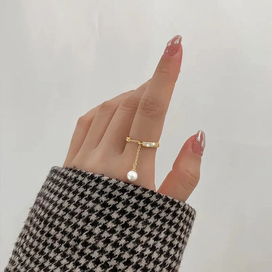 Bague pendentif réglable diamants perle
