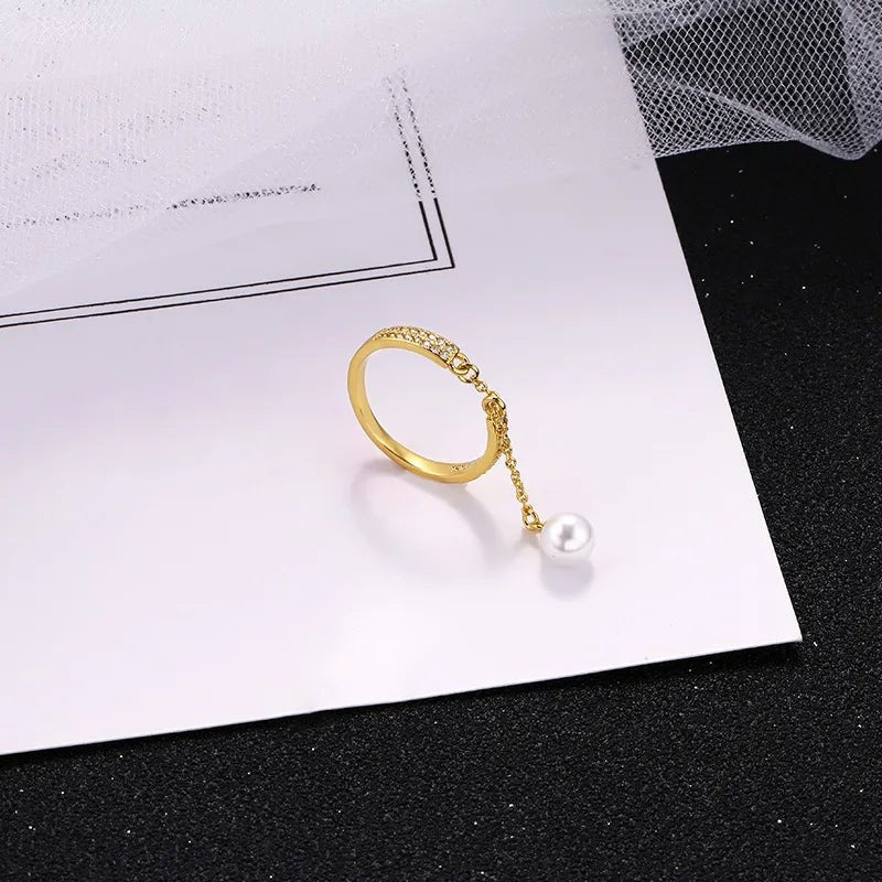 Bague pendentif réglable diamants perle