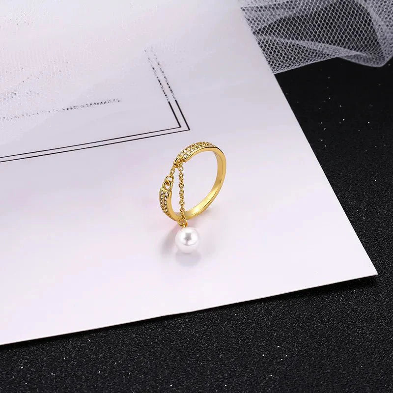 Bague pendentif réglable diamants perle
