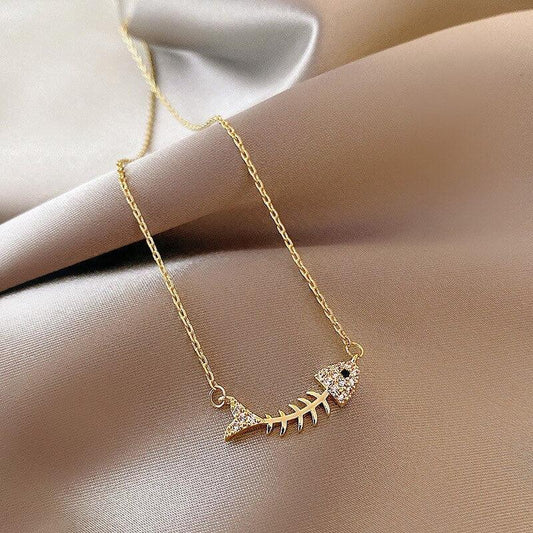 Collier avec pendentif squelette de poisson en strass en plaqué or