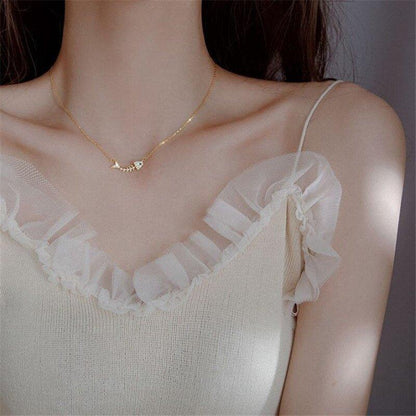 Collier avec pendentif squelette de poisson en strass en plaqué or