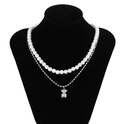 Collier double avec pendentif ourson avec perles