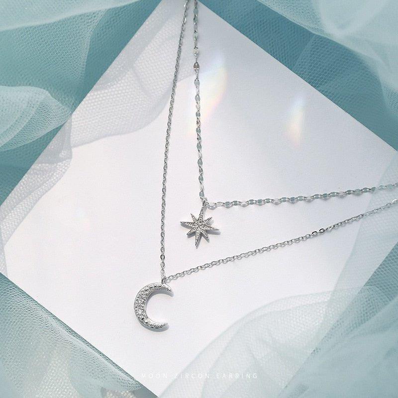 Collier double chaîne pendentif lune et étoile à strass