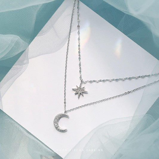 Collier double chaîne pendentif lune et étoile à strass