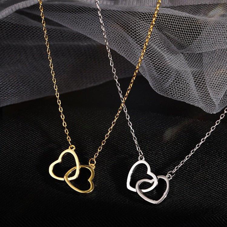 Collier pendentif coeurs entrelacés plaqué argent / or
