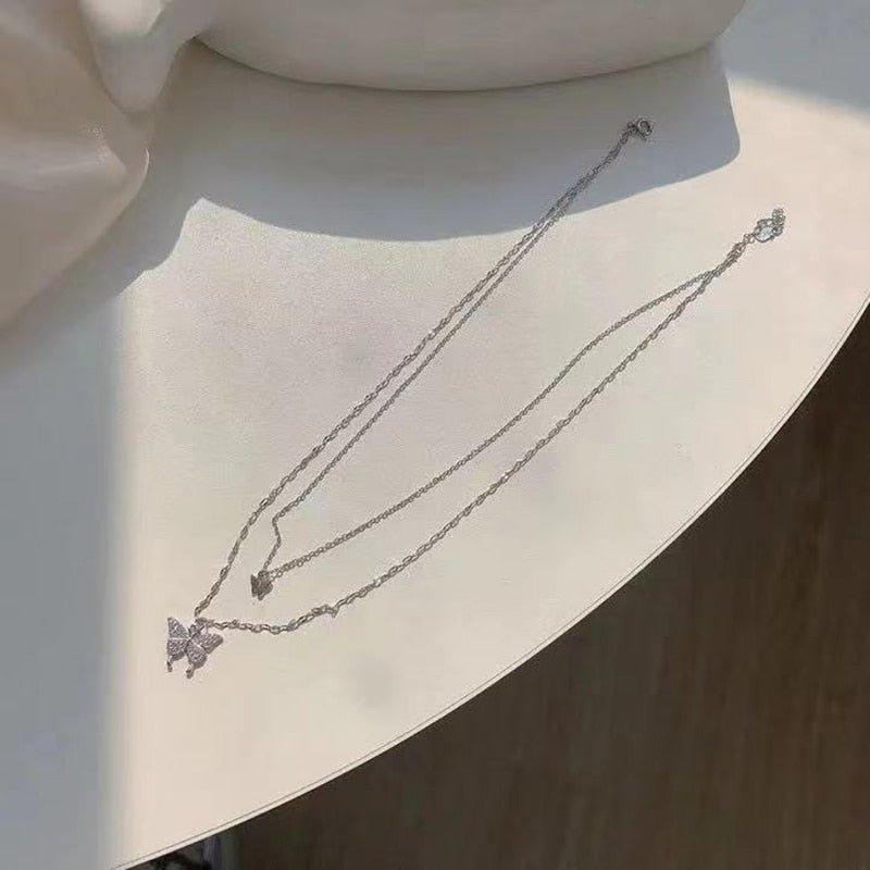 Collier pendentif double papillon plaqué argent