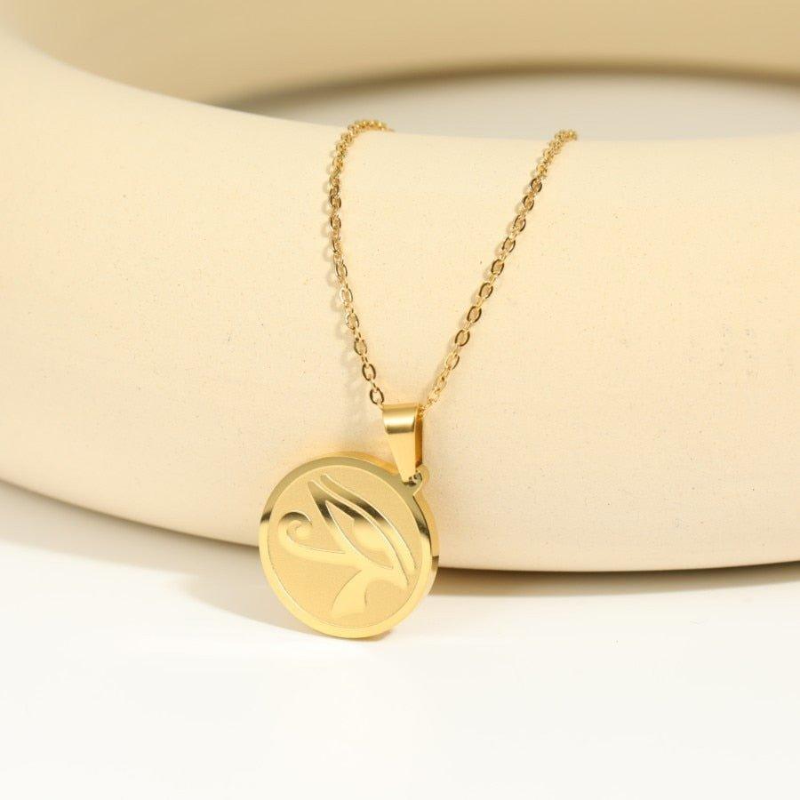Collier pendentif égyptien œil d'Horus médaille ronde plaqué or