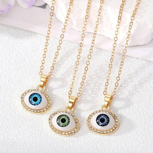 Collier pendentif grand oeil entouré de strass