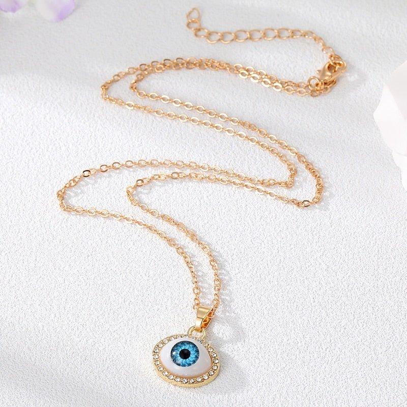 Collier pendentif grand oeil entouré de strass