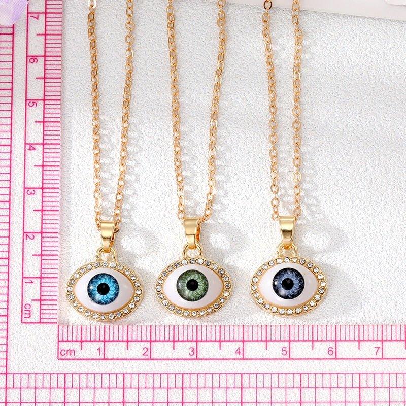 Collier pendentif grand oeil entouré de strass
