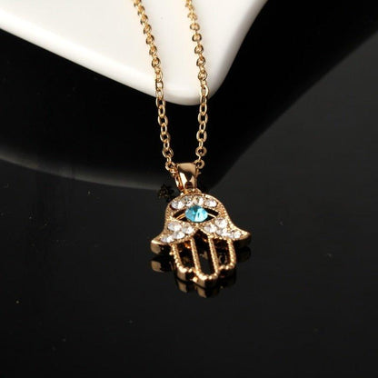 Collier pendentif main de fatma cristaux plaqué or / argent