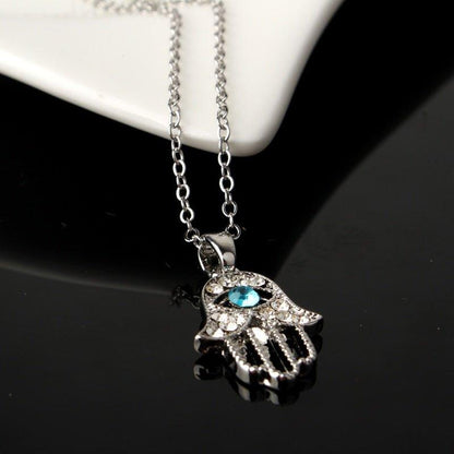 Collier pendentif main de fatma cristaux plaqué or / argent