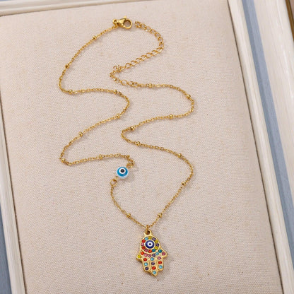 Collier pendentif main de fatma oeil plaqué or / argent