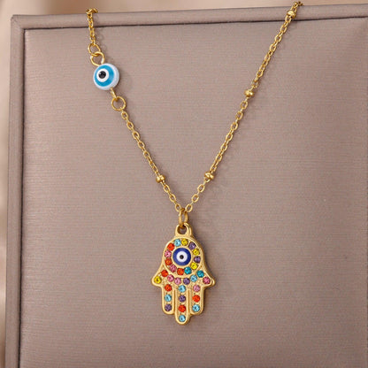 Collier pendentif main de fatma oeil plaqué or / argent