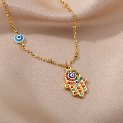 Collier pendentif main de fatma oeil plaqué or / argent