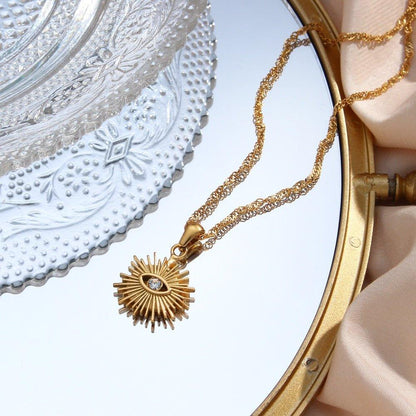 Collier pendentif oeil avec rayons vintage plaqué or