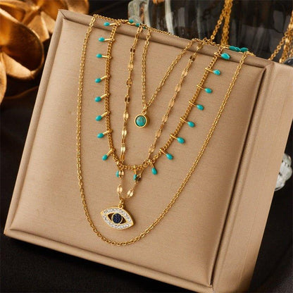 Collier pendentif œil bleu bohémien pierres vertes or plaqué
