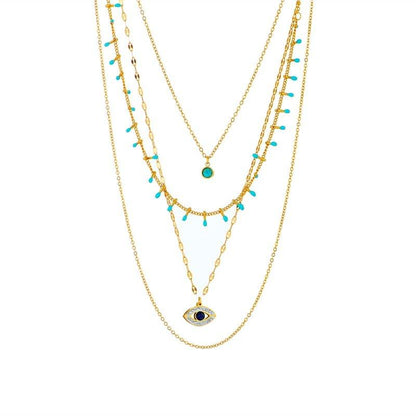 Collier pendentif œil bleu bohémien pierres vertes or plaqué