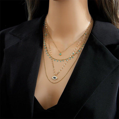 Collier pendentif œil bleu bohémien pierres vertes or plaqué