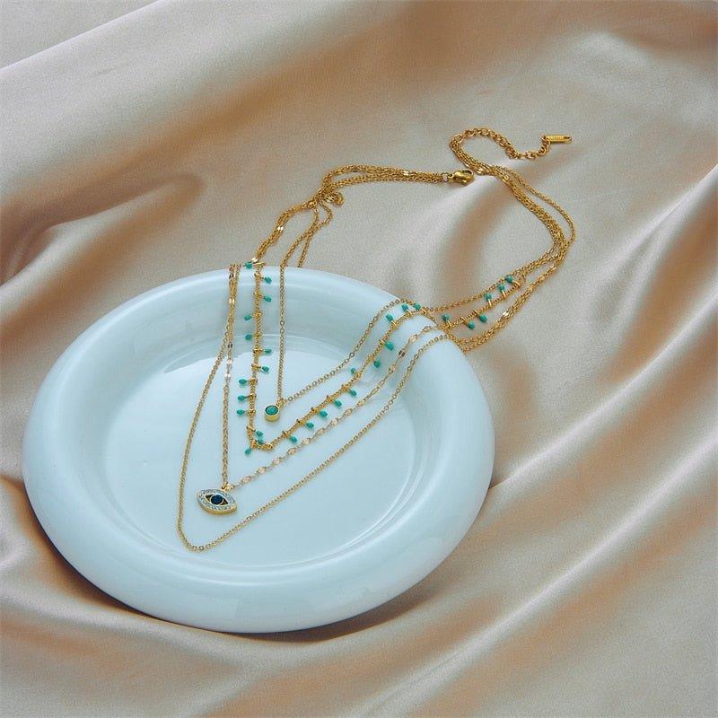 Collier pendentif œil bleu bohémien pierres vertes or plaqué
