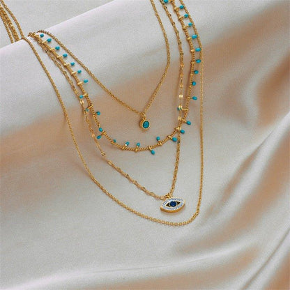 Collier pendentif œil bleu bohémien pierres vertes or plaqué