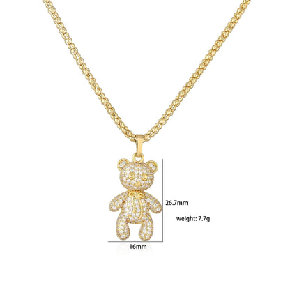 Collier pendentif ourson strassé plaqué or / argent