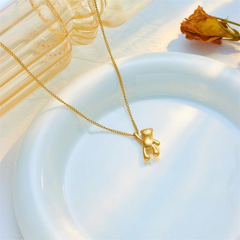 Collier pendentif ourson suspendu plaqué or