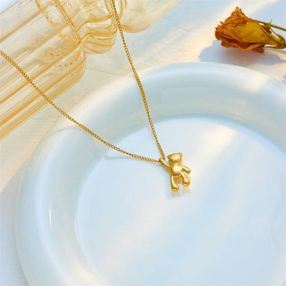 Collier pendentif ourson suspendu plaqué or