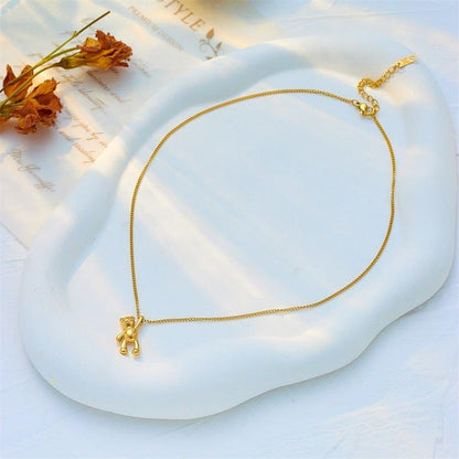 Collier pendentif ourson suspendu plaqué or