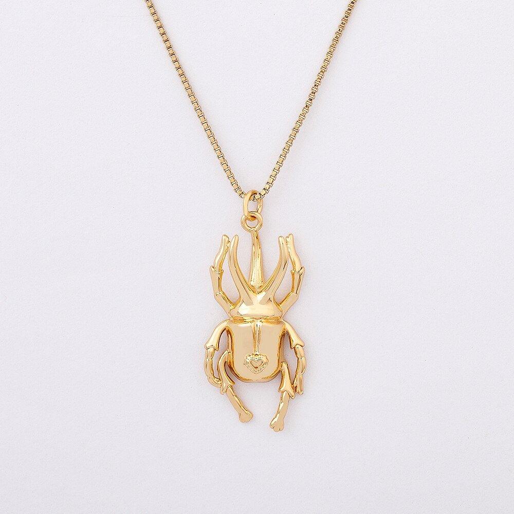 Collier pendentif scarabée long pates