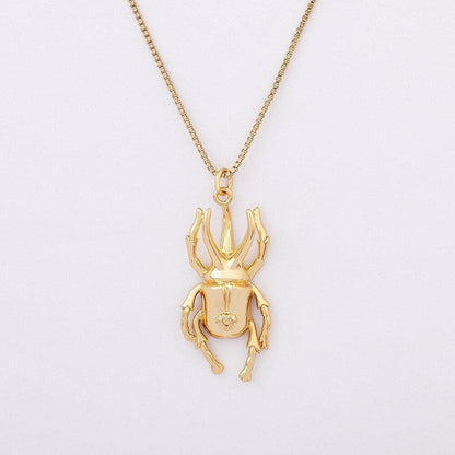Collier pendentif scarabée long pates