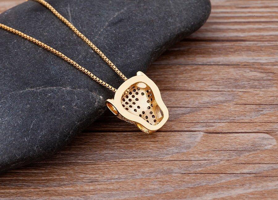 Collier pendentif tête de panthère en strass plaqué or