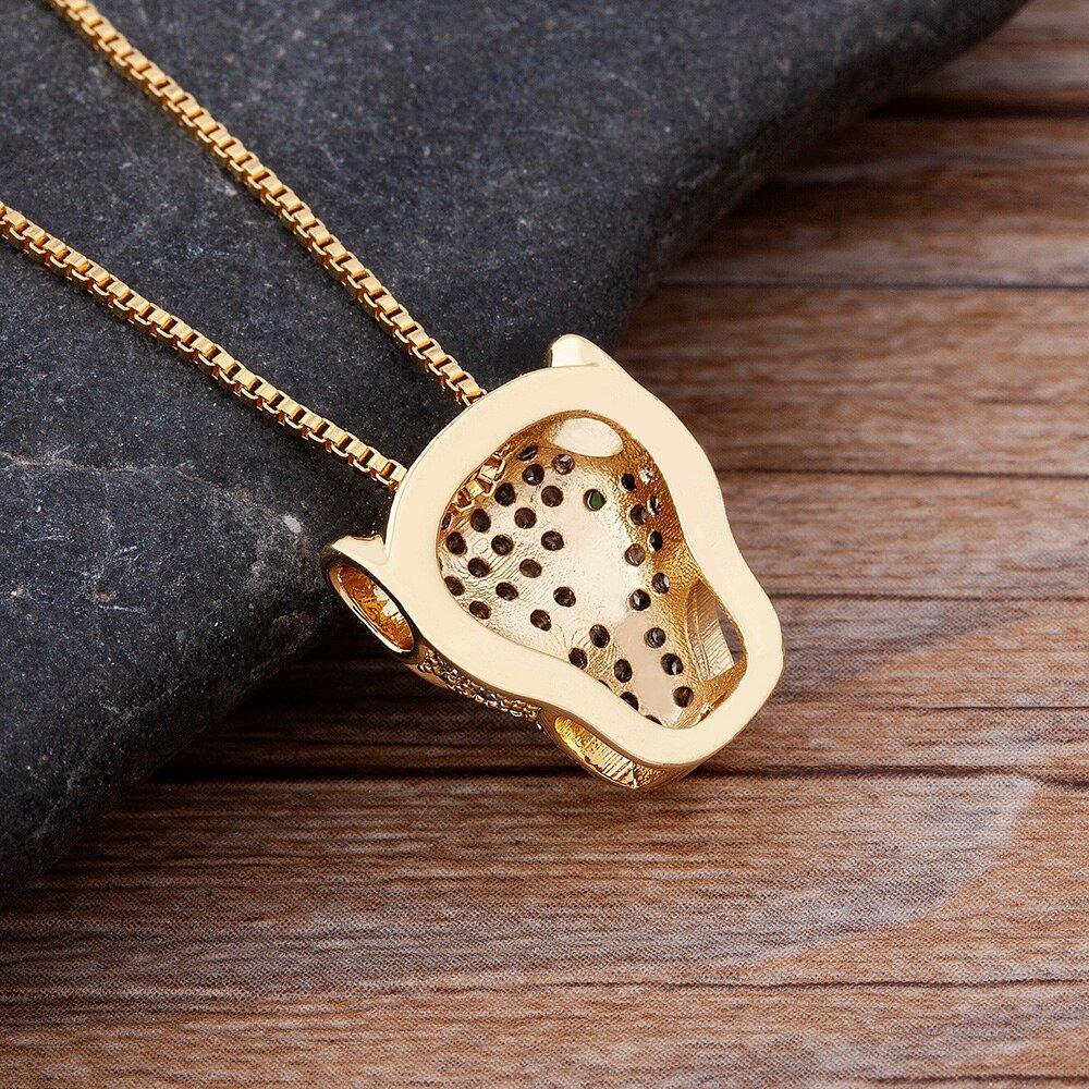 Collier pendentif tête de panthère en strass plaqué or