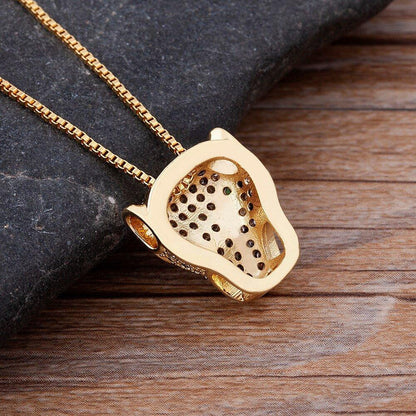 Collier pendentif tête de panthère en strass plaqué or