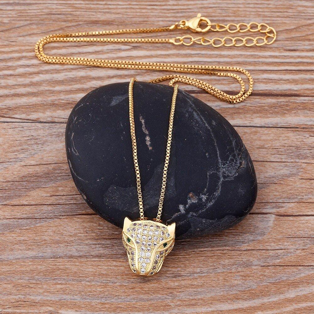 Collier pendentif tête de panthère en strass plaqué or