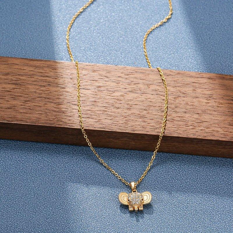 Collier pendentif tête éléphant strass plaqué or