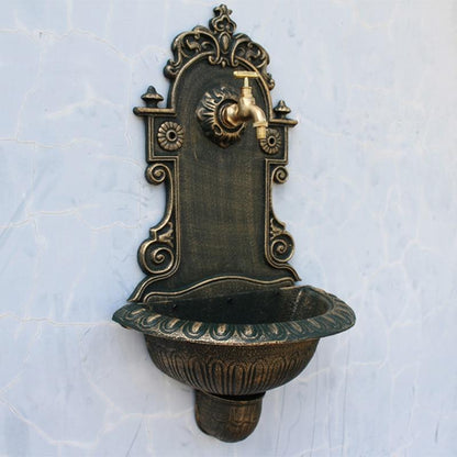 Fontaine murale en fonte