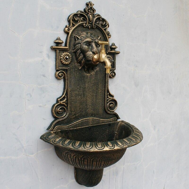 Fontaine murale tête de lion