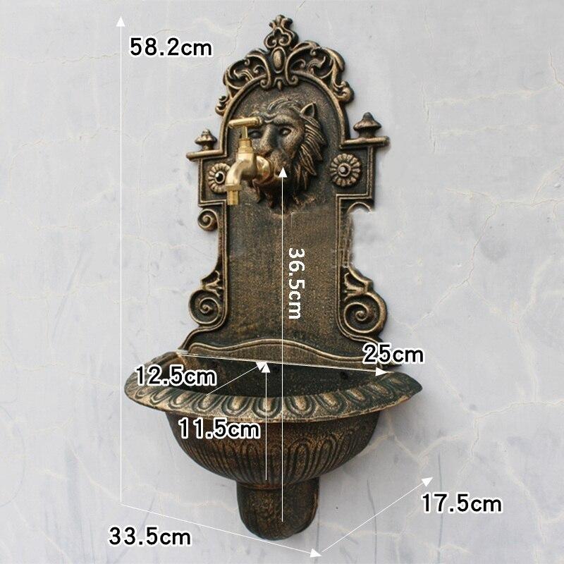 Fontaine murale tête de lion