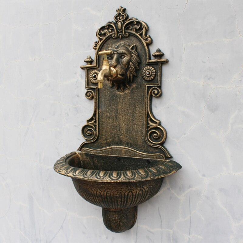Fontaine murale tête de lion