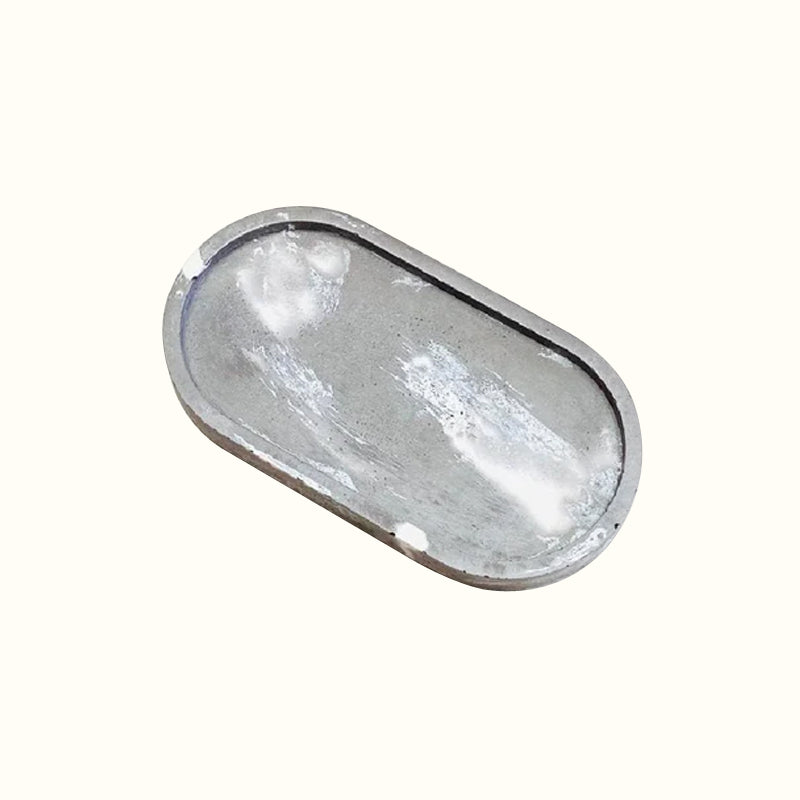 Plateau bijoux ovale marbré en béton